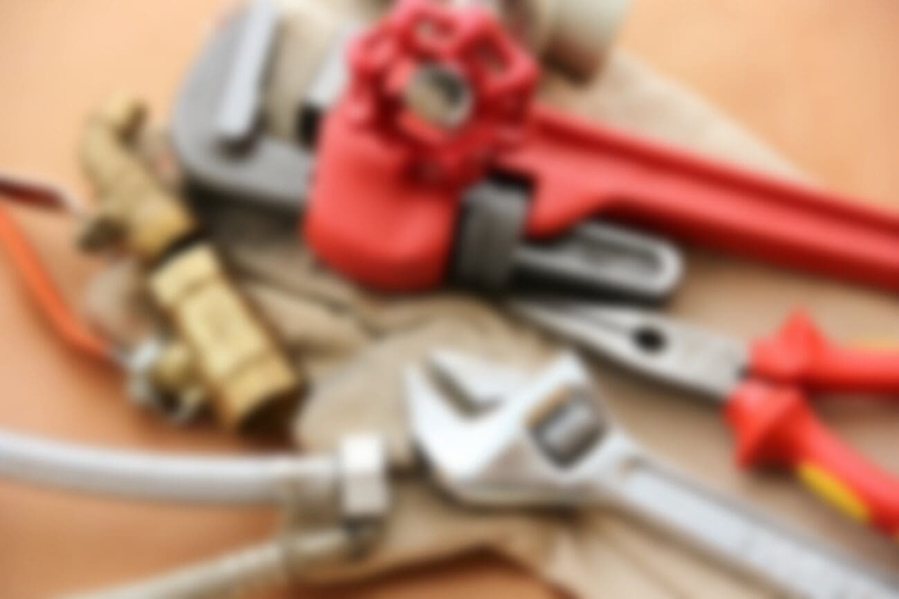 Blurred plumbing tools background image